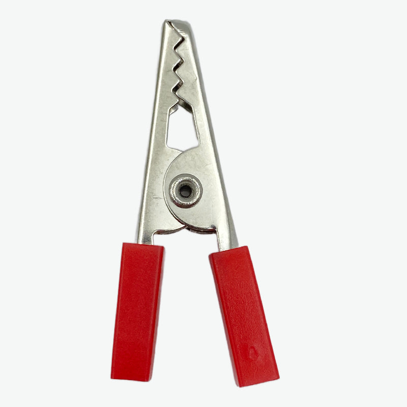 Metal clip with red plastic handles on a white background